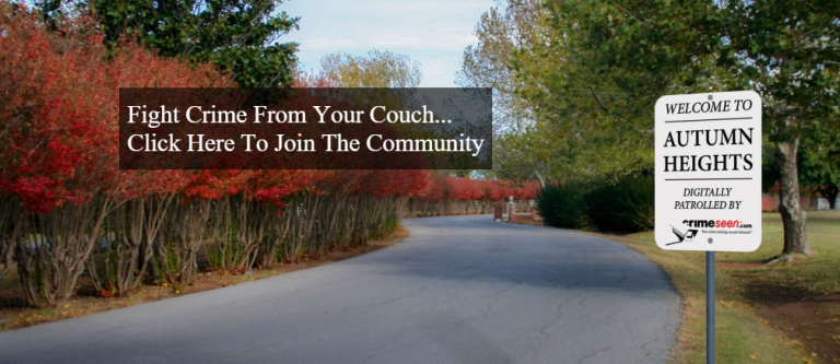 Foto van een weg met rode herfststruiken en een bord “Welcome to Autumn Heights, digitally patrolled by crimeseen.com”, met de tekst “Fight Crime From Your Couch... Click Here To Join The Community”.
