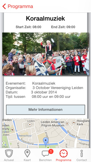 Programmascherm van een app voor de Leidse 3 October Vereeniging met het onderdeel ‘Koraalmuziek’ op 3 oktober 2014 van 08:00 tot 09:00 uur. Er staat een foto van een grote menigte bij een dirigent en een kaartje van de binnenstad van Leiden.
