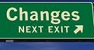 Icoon van een groen verkeersbord met de tekst “Changes next exit”.